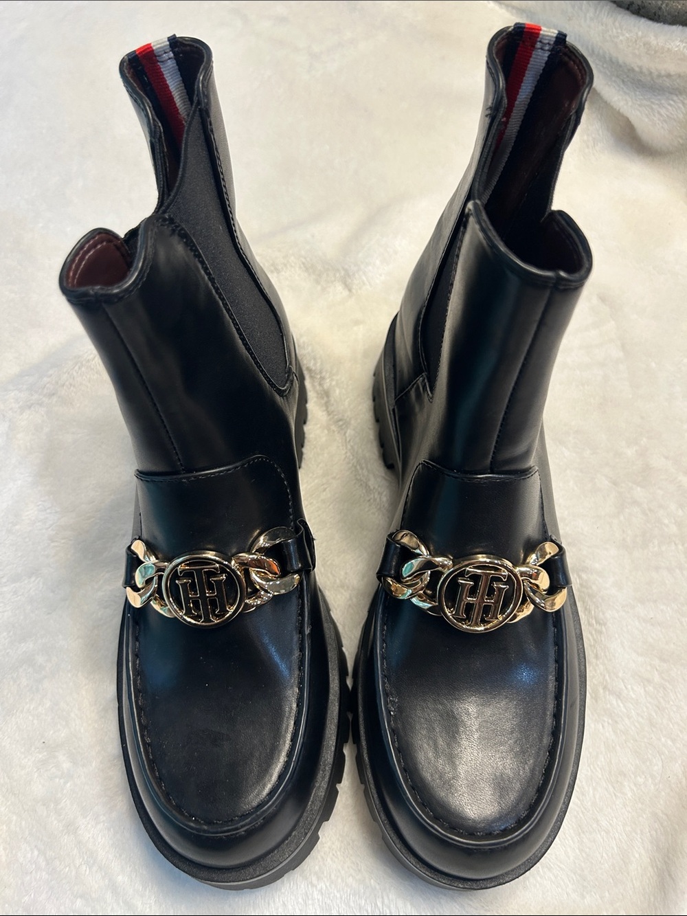 Tommy Hilfiger Black Chelsea Booties with Gold Chain Accent